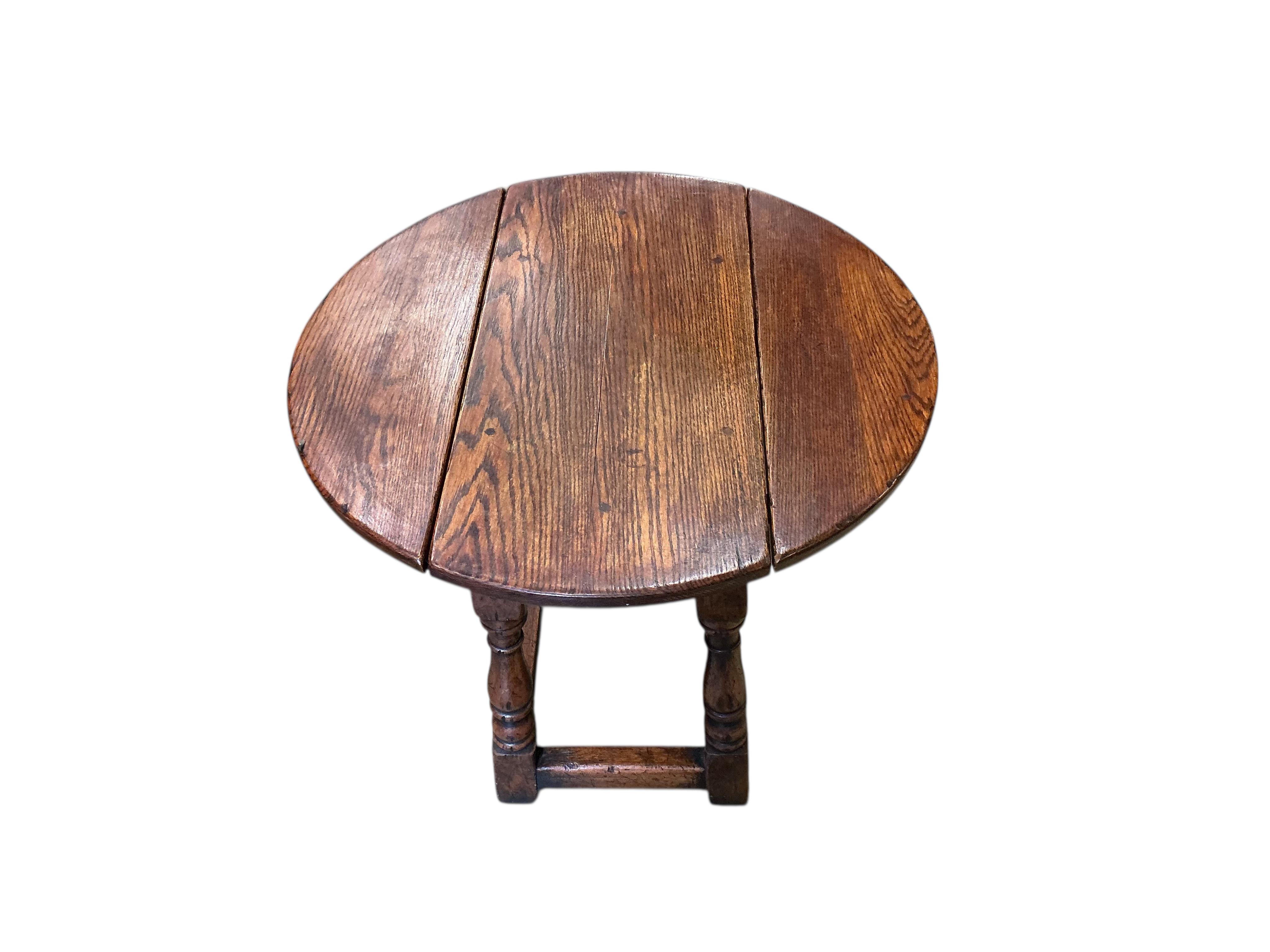 Two 17th century style rectangular oak joint stools, larger width 48cm, depth 31cm, height 53cm, together with a later oak drop flap occasional table